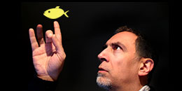 man pointing at a drawn yellow fish