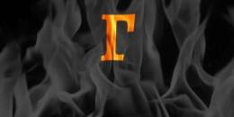 Greek letter Gamma (corresponding to number 3) on a background of flames